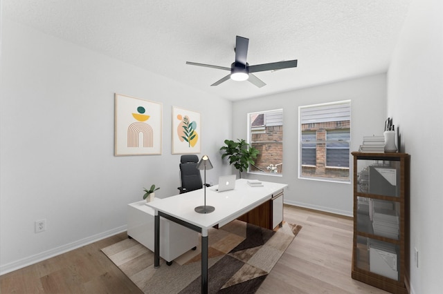 2411 Irish Spring Dr, Houston, TX 77067 - office space with light wood-style flooring, baseboards, and ceiling fan