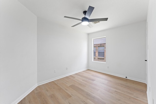 2411 Irish Spring Dr, Houston, TX 77067 - unfurnished room with light wood-style flooring, a ceiling fan, and baseboards