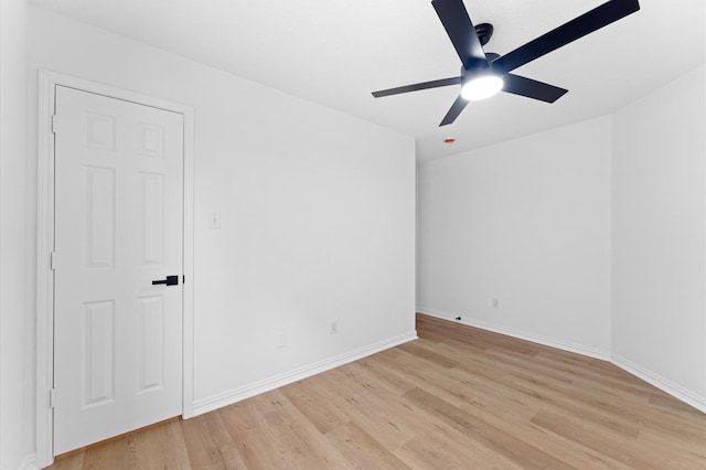 2411 Irish Spring Dr, Houston, TX 77067 - unfurnished room with light wood finished floors, a ceiling fan, and baseboards