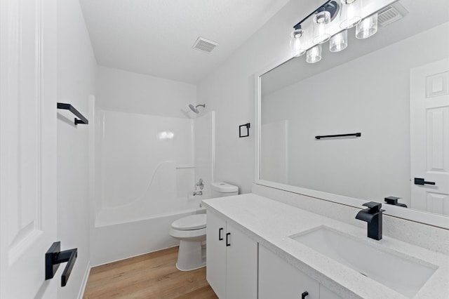 2411 Irish Spring Dr, Houston, TX 77067 - full bath featuring toilet, vanity, wood finished floors, and bathing tub / shower combination