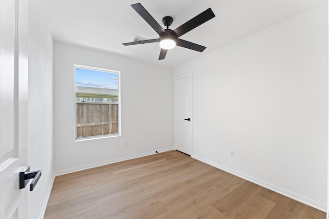2411 Irish Spring Dr, Houston, TX 77067 - spare room featuring light wood finished floors, a ceiling fan, and baseboards