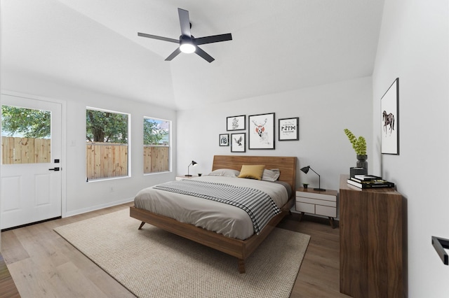 2411 Irish Spring Dr, Houston, TX 77067 - bedroom with vaulted ceiling, wood finished floors, a ceiling fan, and baseboards