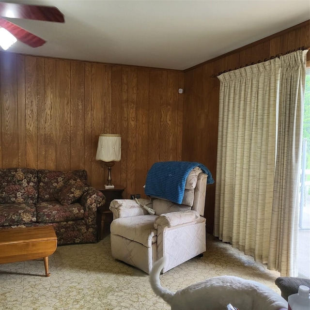 119 Poppy St SE, Lake Jackson, TX 77566 - living area featuring wooden walls, a ceiling fan, and healthy amount of natural light