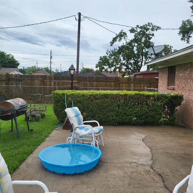 119 Poppy St SE, Lake Jackson, TX 77566 - view of patio / terrace with a grill