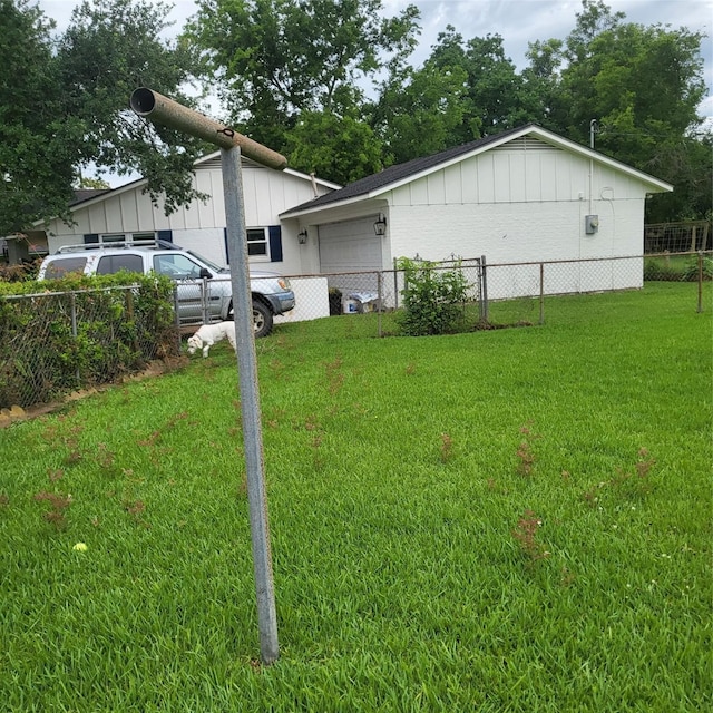 119 Poppy St SE, Lake Jackson, TX 77566 - view of home's exterior featuring board and batten siding and an attached garage