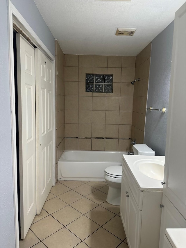 227 S Brownell St, La Porte, TX 77571 - bathroom featuring vanity, toilet, tile patterned floors, and washtub / shower combination