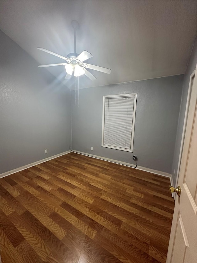 227 S Brownell St, La Porte, TX 77571 - empty room with a ceiling fan, dark wood-style flooring, and baseboards
