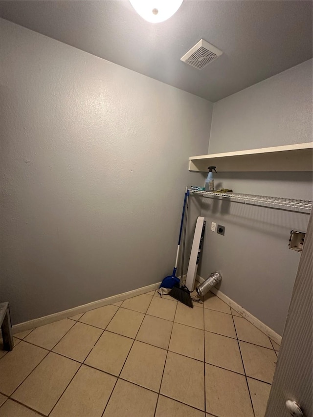 227 S Brownell St, La Porte, TX 77571 - laundry room with hookup for an electric dryer, baseboards, and light tile patterned flooring
