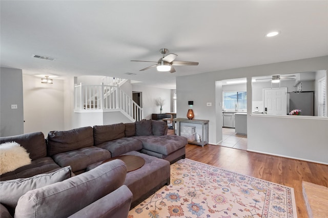 3707 Brook Shadow Dr, Houston, TX 77345 - living area featuring ceiling fan, stairs, wood finished floors, recessed lighting, and baseboards