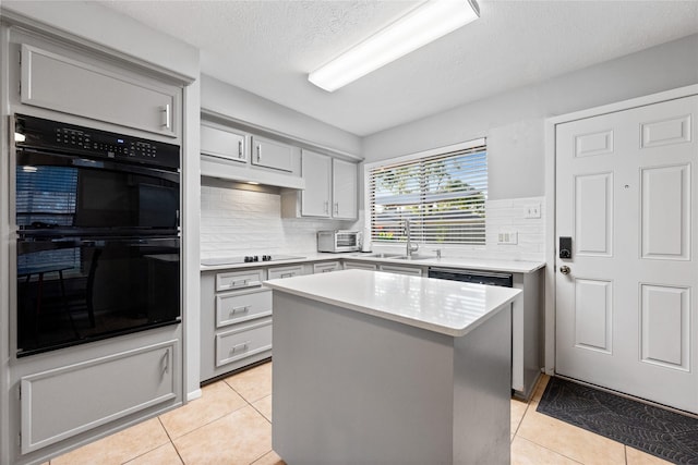 3707 Brook Shadow Dr, Houston, TX 77345 - kitchen featuring gray cabinets, black appliances, light tile patterned flooring, light countertops, and a textured ceiling