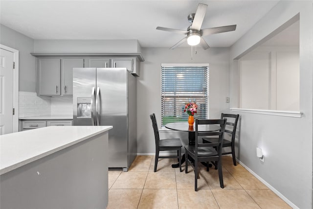 3707 Brook Shadow Dr, Houston, TX 77345 - dining space with ceiling fan, light tile patterned flooring, and baseboards