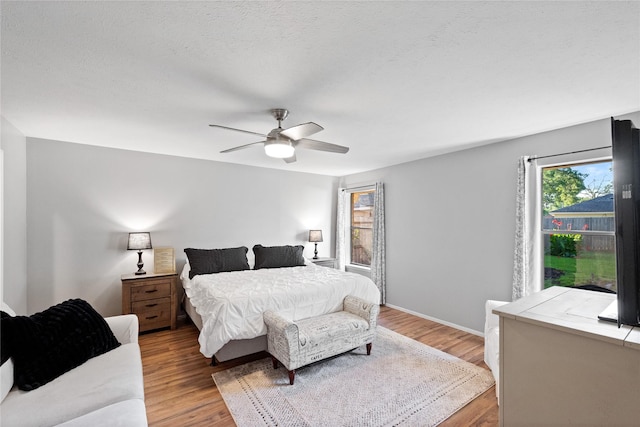 3707 Brook Shadow Dr, Houston, TX 77345 - bedroom with wood finished floors, ceiling fan, and baseboards