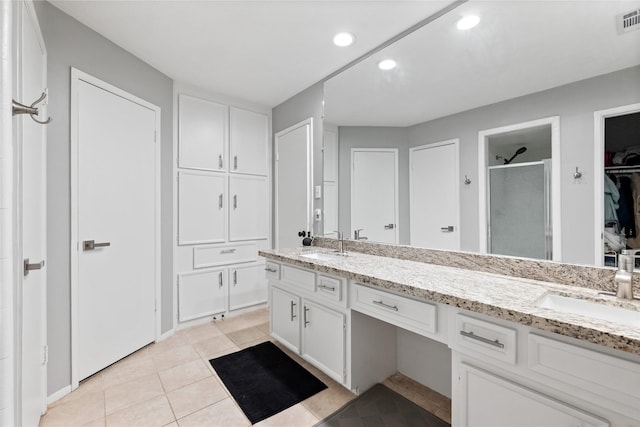 3707 Brook Shadow Dr, Houston, TX 77345 - bathroom with a shower stall, double vanity, recessed lighting, tile patterned flooring, and a walk in closet