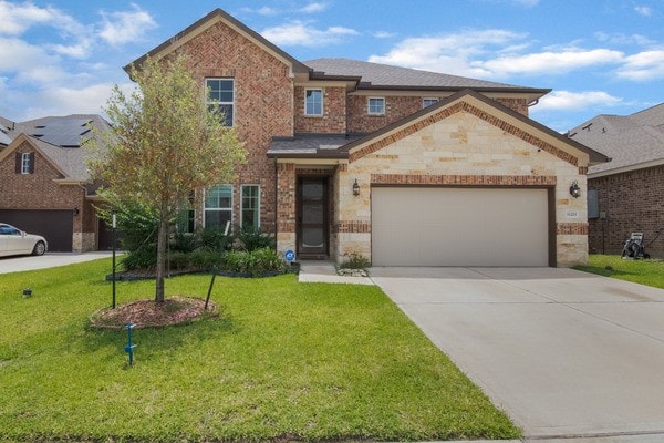 11211 Stirton, Tomball, TX 77375 - view of front of house featuring brick siding, concrete driveway, a front lawn, and a garage