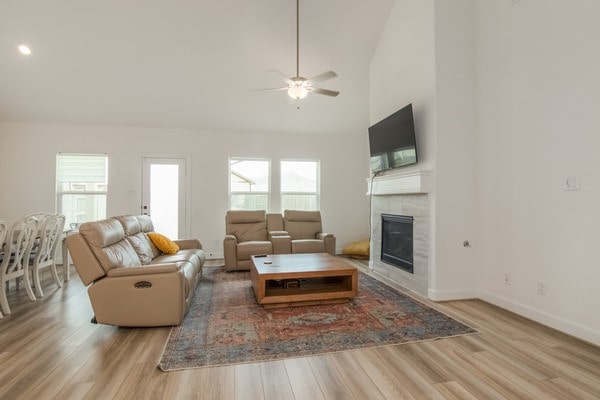 11211 Stirton, Tomball, TX 77375 - living room with healthy amount of natural light, wood finished floors, and a tile fireplace