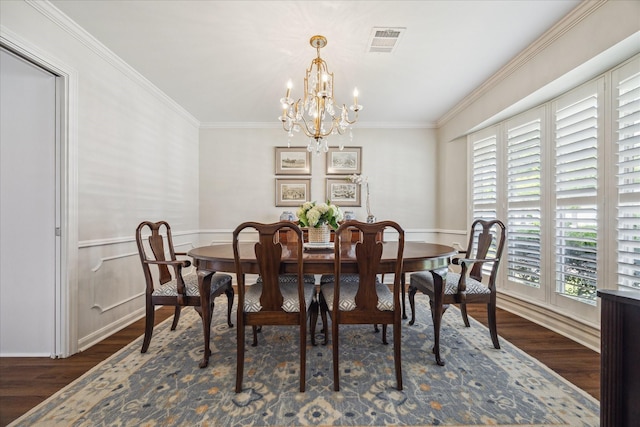 2910 Ann Arbor Dr, Houston, TX 77063 - dining space with wood finished floors, a chandelier, ornamental molding, and wainscoting