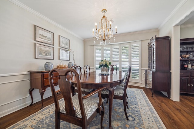 2910 Ann Arbor Dr, Houston, TX 77063 - dining space with a chandelier, wood finished floors, crown molding, and a wainscoted wall