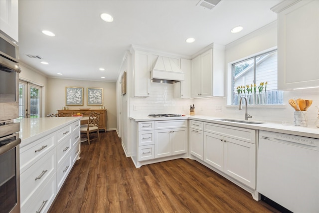 2910 Ann Arbor Dr, Houston, TX 77063 - kitchen featuring dishwasher, a sink, custom range hood, ornamental molding, and dark wood-type flooring