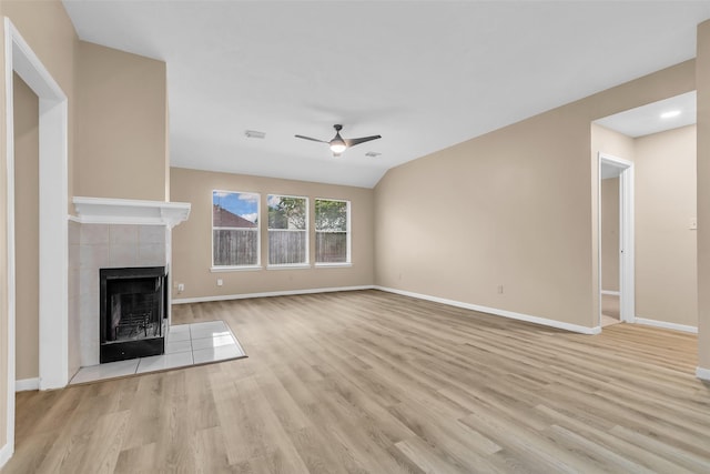 5514 Clarkston Ln, Spring, TX 77379 - unfurnished living room featuring a ceiling fan, a fireplace, light wood finished floors, and baseboards