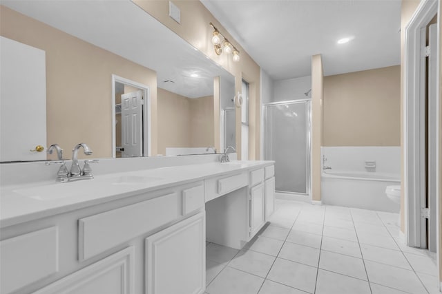 5514 Clarkston Ln, Spring, TX 77379 - bathroom with a shower stall, double vanity, a garden tub, tile patterned flooring, and toilet