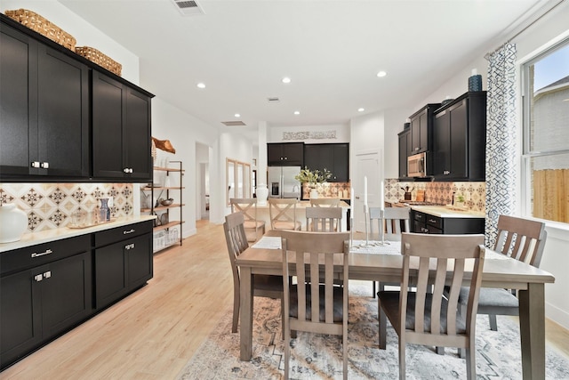 2250 Garden Arbor, Tomball, TX 77375 - dining area with light wood-style floors and recessed lighting
