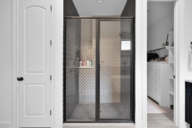 4792 W Fork Blvd, Conroe, TX 77304 - bathroom featuring a shower stall and wood finished floors