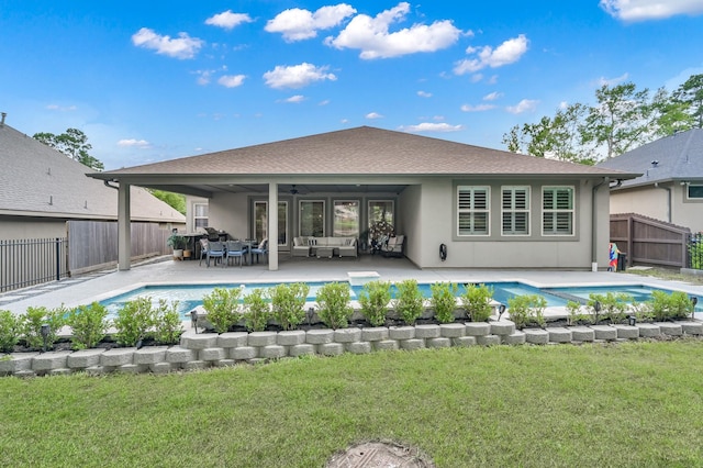 4792 W Fork Blvd, Conroe, TX 77304 - back of house with a ceiling fan, an outdoor hangout area, and stucco siding