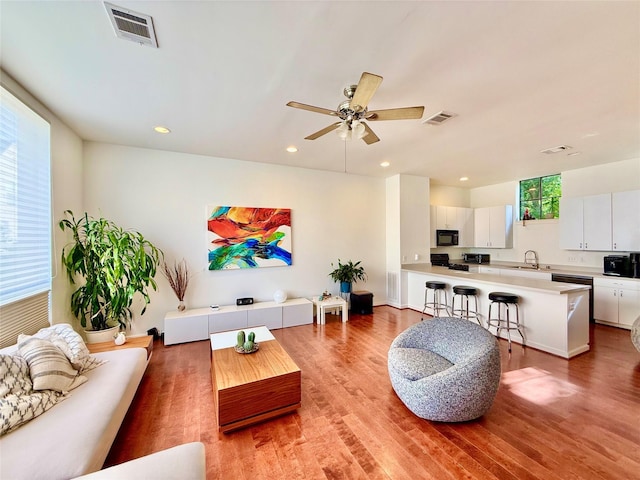 939 Colorado St Unit 8, Houston, TX 77007 - living room featuring light wood-style flooring, recessed lighting, and a ceiling fan