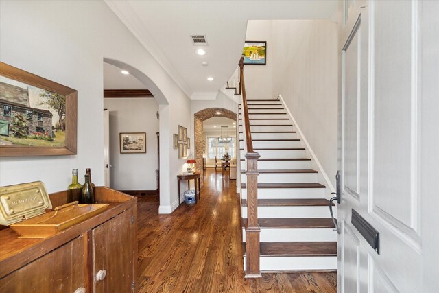 6225 Piping Rock Ln, Houston, TX 77057 - staircase with arched walkways, ornamental molding, wood finished floors, baseboards, and recessed lighting