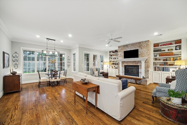 6225 Piping Rock Ln, Houston, TX 77057 - living room with a brick fireplace, a ceiling fan, crown molding, dark wood-style floors, and baseboards