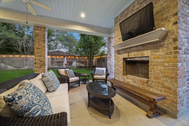 6225 Piping Rock Ln, Houston, TX 77057 - fenced backyard with an outdoor living space with a fireplace, a ceiling fan, and a patio area