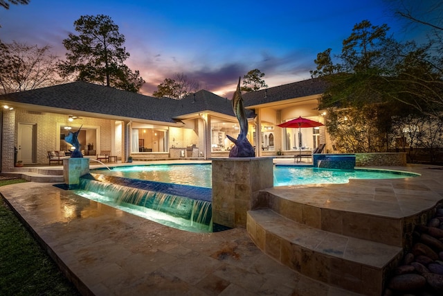 11 Bracebridge Dr, The Woodlands, TX 77382 - pool at dusk with a patio and a pool with connected hot tub