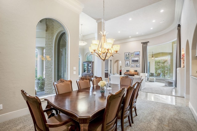 11 Bracebridge Dr, The Woodlands, TX 77382 - dining room with crown molding, arched walkways, a chandelier, recessed lighting, and baseboards
