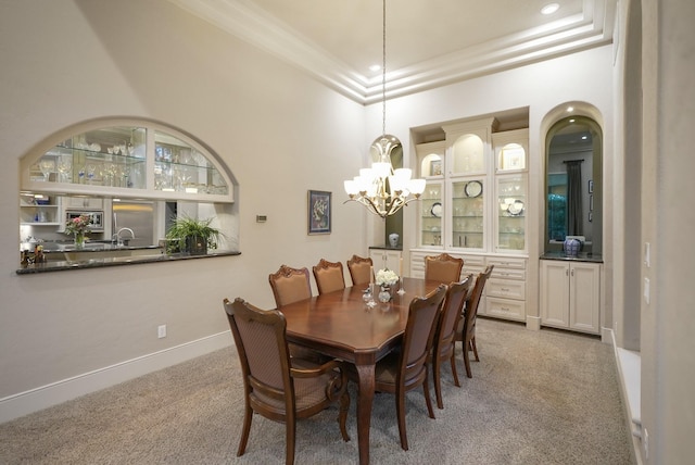 11 Bracebridge Dr, The Woodlands, TX 77382 - carpeted dining room featuring a chandelier, ornamental molding, baseboards, a sink, and recessed lighting