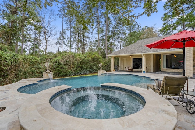11 Bracebridge Dr, The Woodlands, TX 77382 - view of swimming pool with a pool with connected hot tub and a patio area