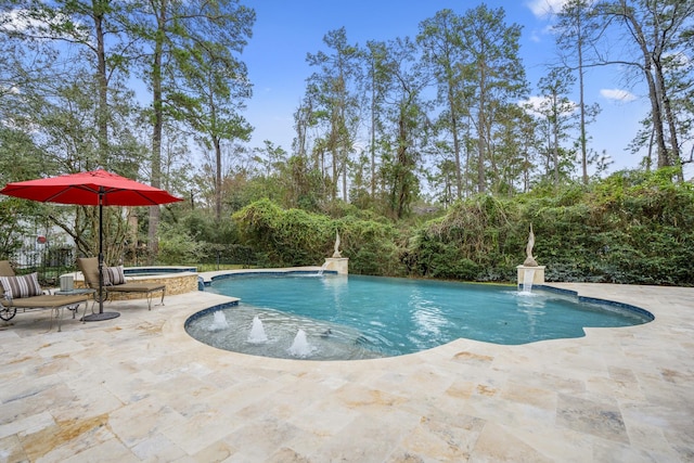 11 Bracebridge Dr, The Woodlands, TX 77382 - view of swimming pool featuring a patio and a pool with connected hot tub