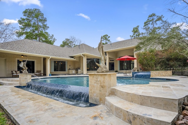 11 Bracebridge Dr, The Woodlands, TX 77382 - outdoor pool featuring an in-ground hot tub, a patio area, and a ceiling fan