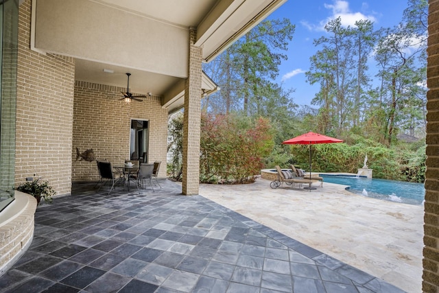 11 Bracebridge Dr, The Woodlands, TX 77382 - view of patio featuring outdoor dining area, a ceiling fan, and an outdoor pool