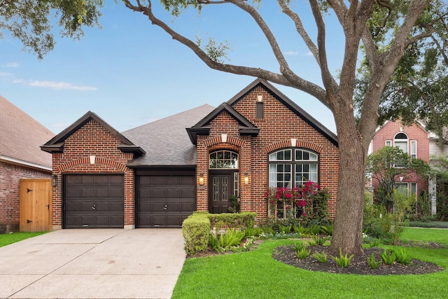 1210 Campton Ct, Houston, TX 77055 - view of front of house with brick siding, an attached garage, driveway, a shingled roof, and a front lawn