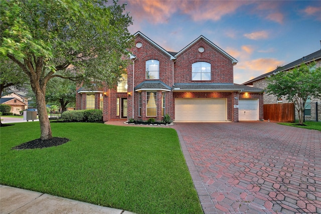 17862 Camp Cove Dr, Cypress, TX 77429 - traditional-style house with decorative driveway, a garage, and brick siding