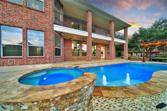17862 Camp Cove Dr, Cypress, TX 77429 - view of swimming pool featuring a patio area, a pool with connected hot tub, and a pergola