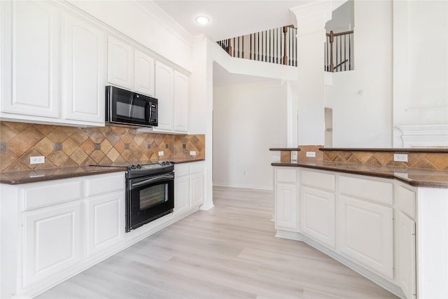 14339 Tasmania Ct, Sugar Land, TX 77498 - kitchen featuring black appliances, backsplash, white cabinetry, light wood-style flooring, and baseboards