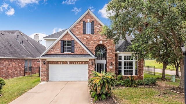 14339 Tasmania Ct, Sugar Land, TX 77498 - view of front of property featuring driveway, brick siding, a garage, and a shingled roof