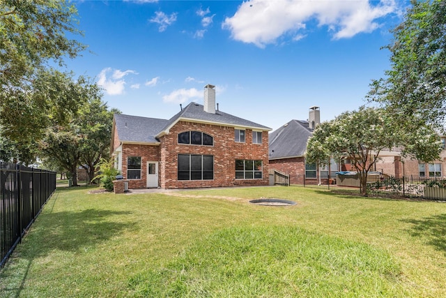 14339 Tasmania Ct, Sugar Land, TX 77498 - back of house featuring brick siding, a chimney, and a shingled roof