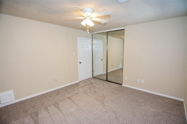 17647 Seven Pines Dr, Spring, TX 77379 - unfurnished bedroom featuring carpet, a textured ceiling, a ceiling fan, a closet, and baseboards