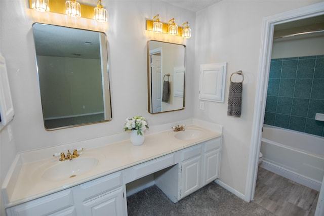 17647 Seven Pines Dr, Spring, TX 77379 - bathroom featuring double vanity, toilet, and baseboards