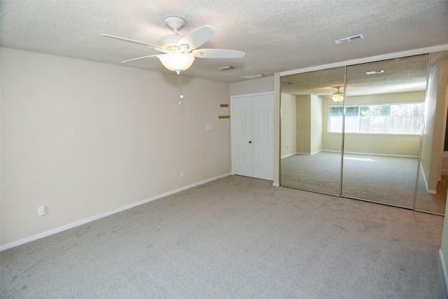 17647 Seven Pines Dr, Spring, TX 77379 - unfurnished bedroom with carpet floors, a textured ceiling, baseboards, and a ceiling fan