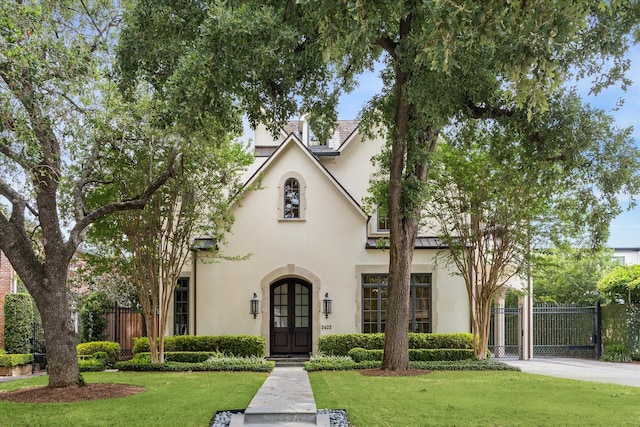 3423 Ella Lee Ln, Houston, TX 77027 - view of front facade featuring stucco siding and a standing seam roof