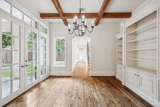 3423 Ella Lee Ln, Houston, TX 77027 - unfurnished dining area with coffered ceiling, wood-type flooring, french doors, baseboards, and beamed ceiling