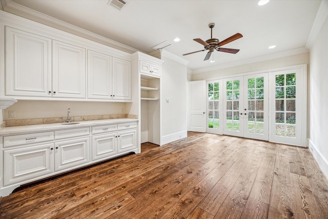 3423 Ella Lee Ln, Houston, TX 77027 - unfurnished living room with french doors, a ceiling fan, crown molding, dark wood finished floors, and recessed lighting